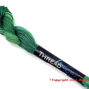 May include: A skein of green and light green embroidery floss with a black label that reads "THREADWORX" and "Copyright 2020 Amara Crafts".