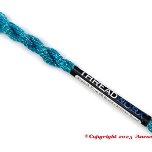 May include: A spool of turquoise thread with a metallic sheen. The label reads "THREAD WORK" and "Kreinik Fine #8 Braid - Artisan Dyed". The thread is tightly wound and appears ready for use in embroidery or other crafts.
