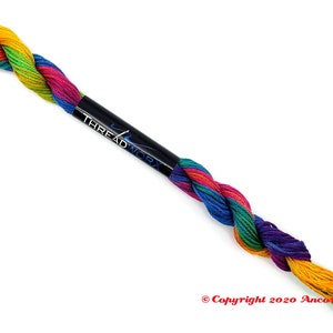 This ThreadworX 1154 rainbow embroidery floss is a gorgeous variegated blend of bright pink, orange, yellow, green, blue, and purple. This thread is used for cross stitch, embroidery, needlepoint, making friendship bracelets, and other crafts.