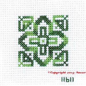 ThreadworX 11611 Variegated Embroidery Floss Tropical thread has a repeating gradient of stunning tropical and forest greens and is shown here stitched in a geometric cross stitch pattern.