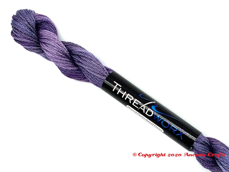ThreadworX 1129 Variegated Embroidery Floss Merlot thread has a repeating gradient of dusky medium and dark purples and is used for cross stitch, embroidery, needlepoint, making friendship bracelets, and other crafts.