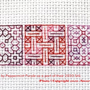 ThreadworX 1096 Variegated Embroidery Floss Renaissance thread has a repeating gradient of dark corals, pink, and red-purple and is shown here stitched in a geometric blackwork embroidery pattern created by Peppermint Purple.
