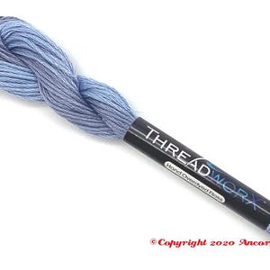 May include: A skein of light blue hand-dyed embroidery floss with a black label that reads "THREADWORKX Hand Overdyed Floss" and "Copyright 2020 Ancora Crafts".