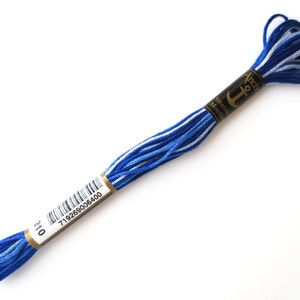 Anchor 1210 Variegated Embroidery Floss Royal Spectrum Ombre thread has a repeating gradient of royal blue to white and is used for cross stitch, embroidery, needlepoint, making friendship bracelets, and other crafts.