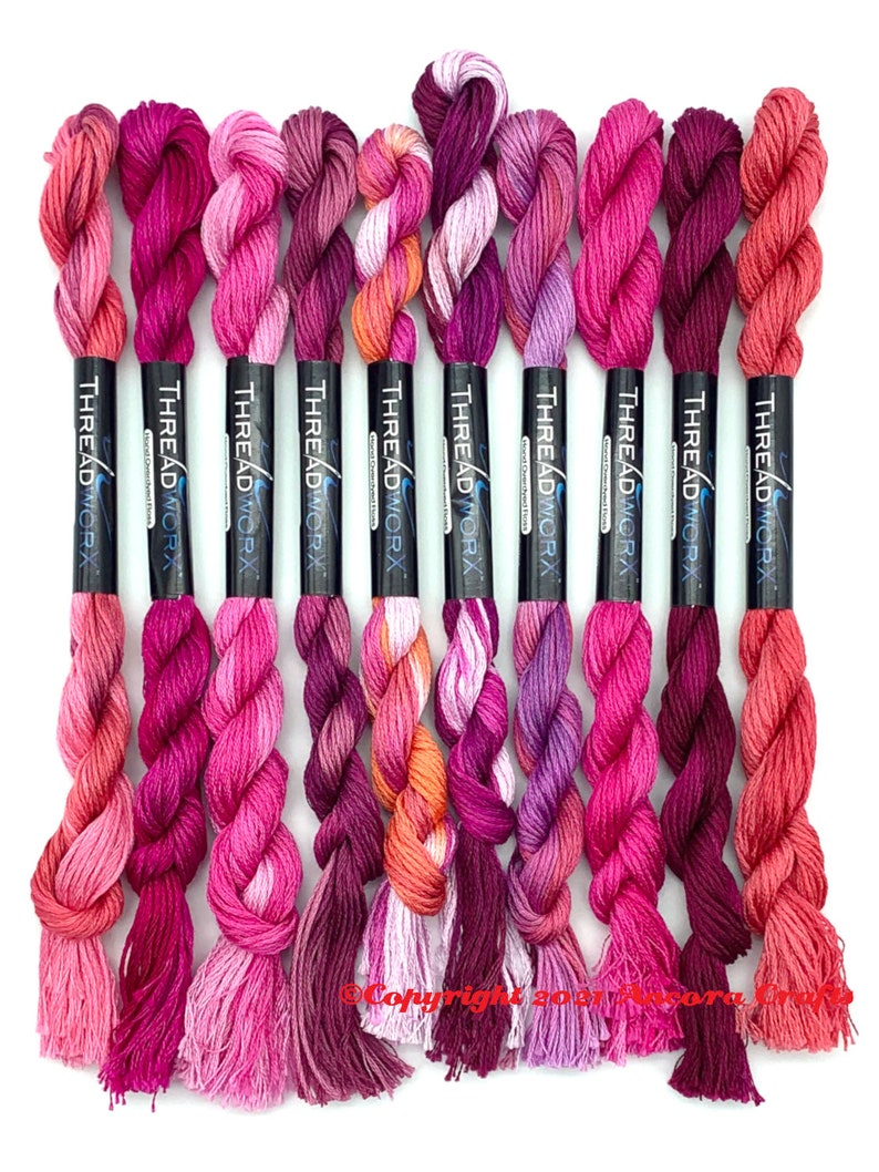 This collection of ten bright pink ThreadworX embroidery threads have repeating gradients of corals, light and dark pinks, and purple-pinks. These are used for cross stitch, embroidery, needlepoint, making friendship bracelets, and other crafts.