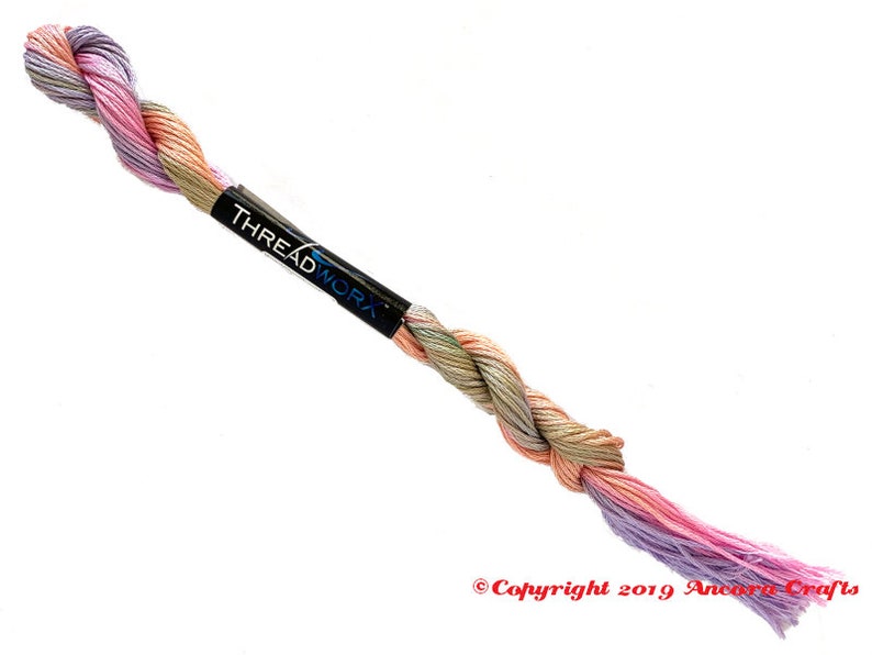 ThreadworX 1149 Variegated Rainbow Embroidery Floss Rainbow Fairy thread has a repeating gradient of soft pink, orange, green, and blue-purple, and is used for cross stitch, embroidery, needlepoint, making friendship bracelets, and other crafts.