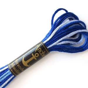 Anchor 1210 Variegated Embroidery Floss Royal Spectrum Ombre thread has a repeating gradient of royal blue to white and is used for cross stitch, embroidery, needlepoint, making friendship bracelets, and other crafts.