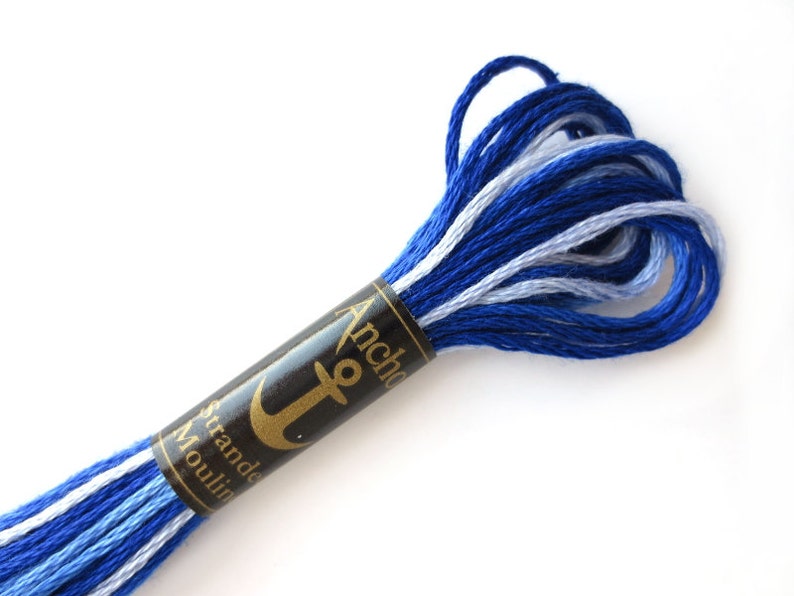 Anchor 1210 Variegated Embroidery Floss Royal Spectrum Ombre thread has a repeating gradient of royal blue to white and is used for cross stitch, embroidery, needlepoint, making friendship bracelets, and other crafts.