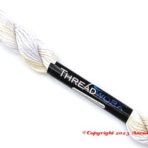 May include: A skein of white and beige hand-dyed embroidery floss with the label "THREADWORX Hand-Overdyed Floss" and the copyright information "Copyright 2023 Ancona Crafts".