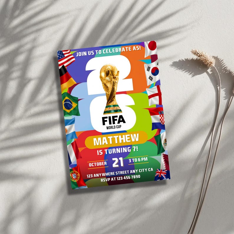 May include: A rectangular birthday invitation card featuring the FIFA World Cup trophy, the text JOIN US TO CELEBRATE AS! 2026 FIFA WORLD CUP, MATTHEW IS TURNING 7!, OCTOBER 21, 3 TO 6 PM, 123 ANYWHERE STREET ANY CITY CA, RSVP AT 123 456 7890, and flags.