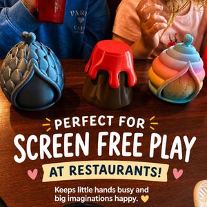 May include: Three small containers with lids. One is dark gray with a scale texture, one is brown with a red dripping top, and one is a pastel rainbow gradient with a stitched pattern. Text reads: PERFECT FOR SCREEN FREE PLAY AT RESTAURANTS!