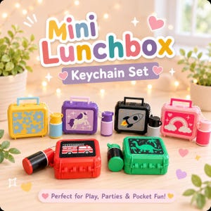 May include: A set of six miniature plastic lunchbox keychains in yellow, purple, black, pink, red, and green. Each lunchbox features a unique graphic including flowers, a unicorn, a rocket, a rainbow, a fire truck, and a dinosaur, with matching thermoses.