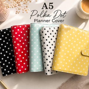 May include: Five A5 planner covers with a polka dot pattern in black, red, light blue, white, and yellow. Each cover features a glossy finish and a secure tab closure. The text A5 Polka Dot Planner Cover is printed above the items.