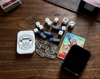 Juego de dados y caja de One Piece TCG (incluye marcadores de poder, coste y efecto, y dados)