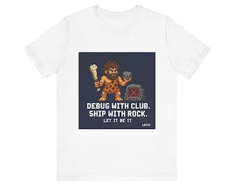 May include: White t-shirt with a pixelated caveman design. The graphic shows a caveman with a club and a rock, and the text "DEBUG WITH CLUB. SHIP WITH ROCK. LET IT BE IT" on a dark blue background.