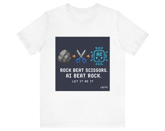 May include: White t-shirt with a graphic design. The design features a pixelated rock, scissors, and an AI chip, with the text "ROCK BEAT SCISSORS. AI BEAT ROCK. LET IT BE IT." The shirt also has the text "LBITS".