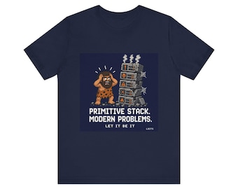 May include: Navy blue t-shirt with a pixelated graphic of a caveman and a stone block stack. The text reads "PRIMITIVE STACK. MODERN PROBLEMS. LET IT BE IT."