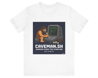 May include: White t-shirt with a graphic of a caveman using a stone-age computer. The design includes the text "CAVEMAN.SH RUNNING SINCE THE STONE AGE LET IT BE IT". A humorous design for tech enthusiasts.