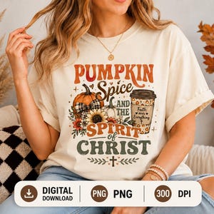 May include: A cream-colored t-shirt featuring a graphic print with the text PUMPKIN SPICE AND THE SPIRIT OF CHRIST. The design includes a pumpkin with a plaid bow, sunflowers, and a coffee cup labeled Faith over Everything with a small cross.
