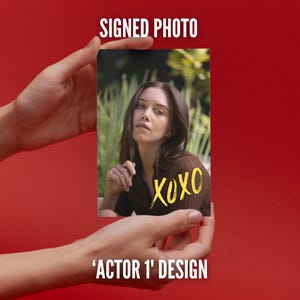 May include: A rectangular photograph featuring a portrait of a person with long brown hair wearing a brown top, set against a blurred green outdoor background. The text SIGNED PHOTO appears above, and the yellow handwritten text XOXO is on the image.