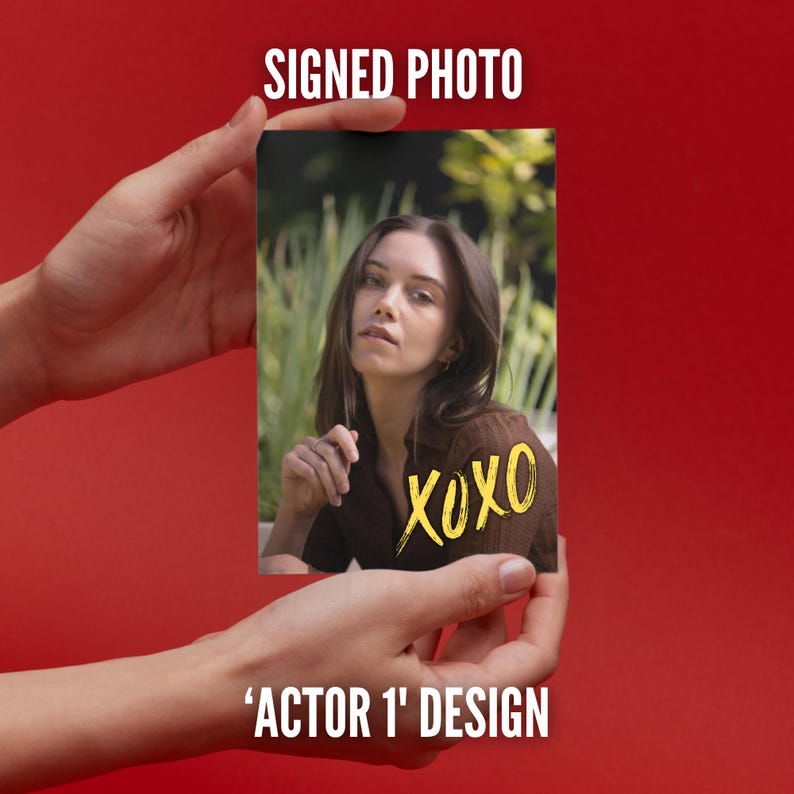 May include: A rectangular photograph featuring a portrait of a person with long brown hair wearing a brown top, set against a blurred green outdoor background. The text SIGNED PHOTO appears above, and the yellow handwritten text XOXO is on the image.