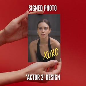 May include: A rectangular photograph featuring a portrait of a person with dark hair wearing a black top, with the yellow handwritten text XOXO overlaid on the bottom right. The image includes the white text SIGNED PHOTO and ACTOR 2 DESIGN.
