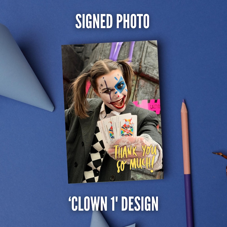 May include: A signed photo featuring a person with clown makeup, pigtails, and a dark blazer over a checkered shirt. The person holds playing cards and wears a lace glove. The text 'THANK YOU SO MUCH!' is printed in yellow on the photo.