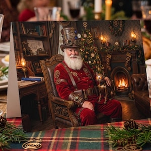 May include: A greeting card featuring a steampunk Santa Claus with a white beard, wearing a top hat with goggles and a red velvet suit, sitting in a leather chair next to a mechanical cat, with a Christmas tree and fireplace in the background.