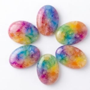 May include: Six oval-shaped cabochons arranged in a circular flower pattern. Each cabochon features a translucent, crackled texture with a vibrant, multi-colored rainbow gradient including shades of pink, blue, yellow, and orange throughout.