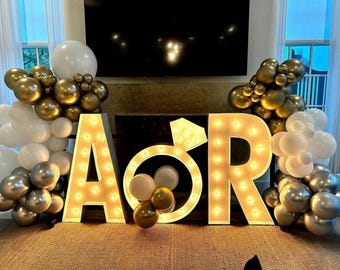 Custom wedding marquee sign: lighted engagement ring decor