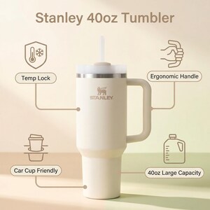 May include: Cream-coloured Stanley 40oz (1.18L) tumbler with a white lid and straw. Features include an ergonomic handle, car cup compatibility, and temperature lock. The tumbler has a large capacity and the Stanley logo is visible.