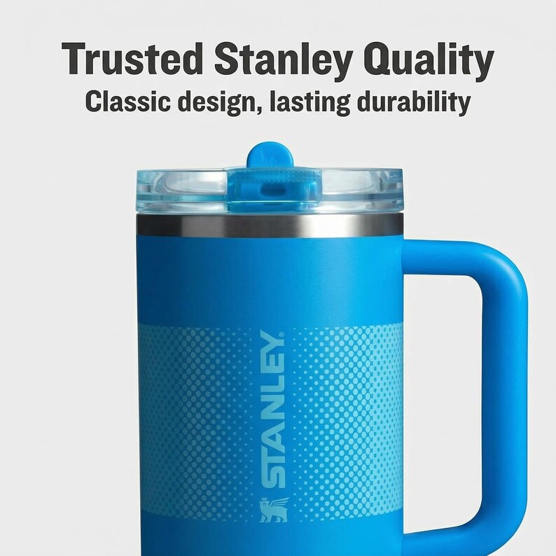 May include: A blue Stanley mug with a handle and a clear lid. The mug has the Stanley logo and the text "Trusted Stanley Quality" and "Classic design, lasting durability".