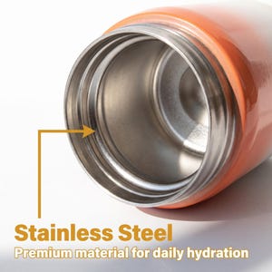 May include: Close-up of a stainless steel water bottle interior. The bottle has an orange and white gradient exterior. The text "Stainless Steel" and "Premium material for daily hydration" are visible.