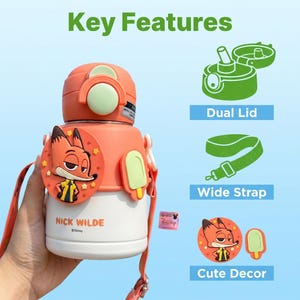 May include: An orange and white water bottle featuring a cartoon fox character. The bottle has a dual lid, a wide strap, and cute decorative elements. The text "Key Features" is at the top of the image.