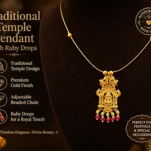 May include: A gold-toned pendant necklace featuring a detailed temple-style deity figure, accented with small red ruby-coloured drops at the base. The pendant hangs from a thin gold chain with small beads, displaying text including Traditional Temple Pendant.