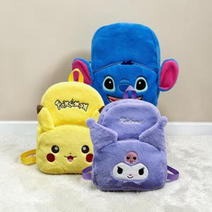 May include: Four plush backpacks in a row. A yellow Pikachu backpack with the word "Pokemon" on it, a blue Stitch backpack, and a purple Kuromi backpack. The backpacks have adjustable straps and zippers.