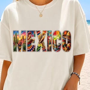 May include: An off-white short-sleeve t-shirt featuring the word MEXICO printed in large block letters. Each letter contains a colorful graphic illustration of Mexican cultural elements including a cactus, a dancer, a taco, and maracas.