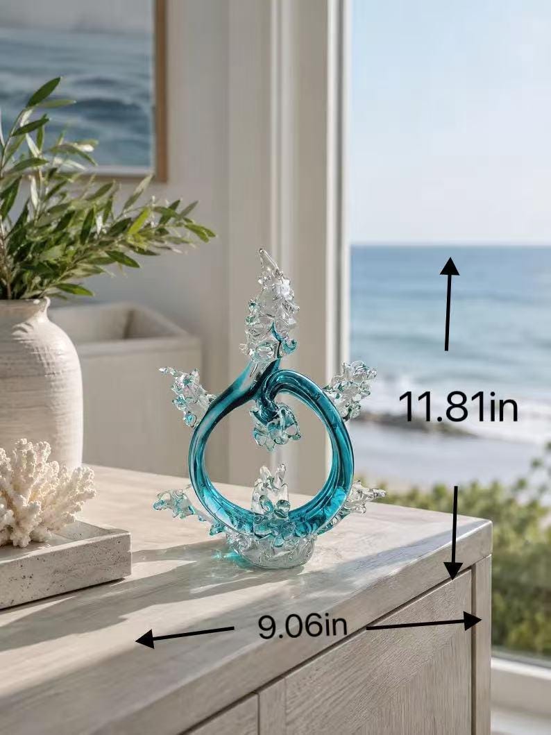 Puede incluir: Una escultura circular de vidrio color verde azulado y transparente con detalles texturizados en forma de olas. La escultura mide 30 cm de alto y 23 cm de ancho, seg&uacute;n lo indicado por las flechas negras y el texto en la imagen.