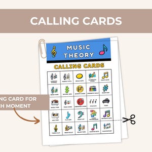 May include: A stack of music theory calling cards with a blue header that reads "Music Theory" and "Calling Cards". The cards feature various musical symbols and terms, including notes, chords, and clefs. A paperclip holds the cards together.