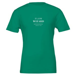 May include: A solid emerald green short-sleeve t-shirt featuring white text centered on the chest. The text reads FLOW WIZARD in a bold serif font, followed by a horizontal line and the smaller text admin life in a simple sans-serif font.