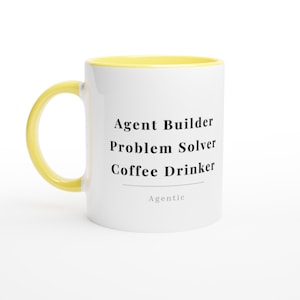May include: A white ceramic mug with a yellow handle and interior rim. The front features black text that reads Agent Builder, Problem Solver, Coffee Drinker, with a horizontal line and the word Agentic printed in smaller gray font below it.