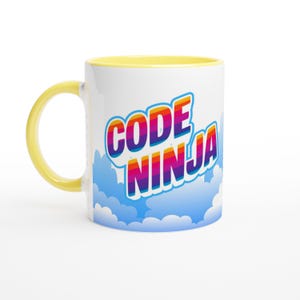 May include: A white ceramic mug with a bright yellow handle and rim. The mug features a graphic of light blue clouds at the base and the text CODE NINJA in a bold, multi-coloured rainbow gradient font with a white outline centred on the side.