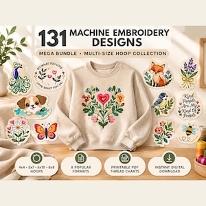 May include: A beige sweatshirt featuring a central floral heart embroidery design, surrounded by 131 machine embroidery design stickers including a fox, peacock, puppy, butterfly, bee, and text reading 131 MACHINE EMBROIDERY DESIGNS.