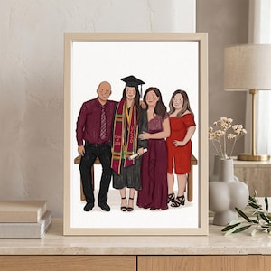 May include: A framed illustration of a family of four. The graduate wears a cap and gown with a UCSD sash. The family is dressed in burgundy and red attire. The illustration is in a light wood frame, resting on a light-colored surface.