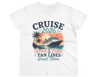 May include: White t-shirt with a colorful graphic design. The design features a cruise ship sailing on the ocean, palm trees, a sunset, and the words "CRUISE 2026", "Good Vibes", "Tan Lines", and "Great Times".