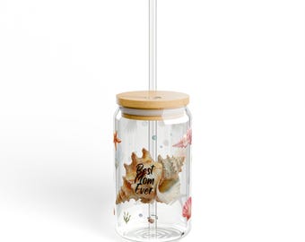 May include: A clear glass tumbler with a bamboo lid and straw. The tumbler is decorated with watercolor seashells and the text "Best Mom Ever". The design includes starfish and aquatic plants.