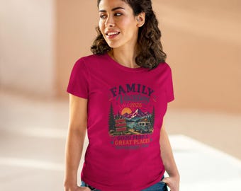 May include: A magenta t-shirt featuring a graphic with the text "FAMILY VACATION 2026" above a mountain scene with a vehicle. The shirt also includes the text "GOOD PEOPLE GREAT PLACES".