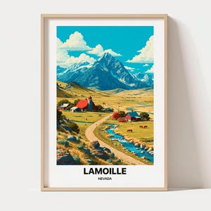 May include: A framed art print featuring a landscape of Lamoille, Nevada, with a snow-capped mountain, a winding dirt road, a blue stream, and red barns in a grassy valley under a bright blue sky with white clouds. The text reads LAMOILLE NEVADA.