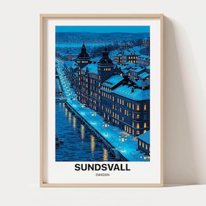 May include: A framed wall art print featuring a blue-toned night cityscape of Sundsvall, Sweden, with snow-covered buildings, illuminated street lamps along a waterfront, and the text SUNDSVALL SWEDEN printed in black at the bottom of the image.