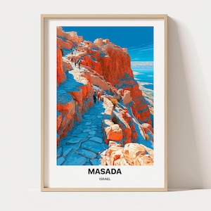 May include: A framed travel poster featuring a vibrant illustration of the Masada fortress in Israel. The artwork depicts a winding stone path leading up steep, orange-hued cliffs against a bright blue sky. The text MASADA ISRAEL is printed below.